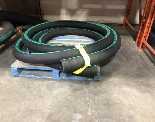 Yellow strap bundling hose on a pallet