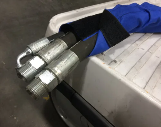 Blue sleeve on hydraulic hoses