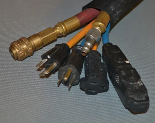 Sleeve bundling air lines and cords