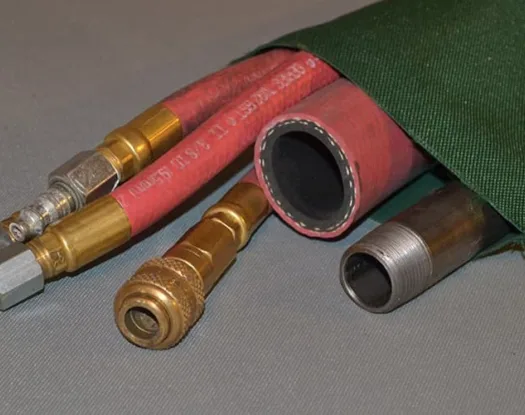 Green sleeve over red air hoses
