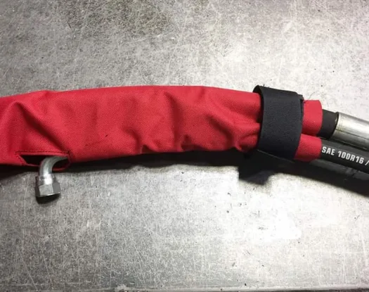 Sleeve end closed with a strap