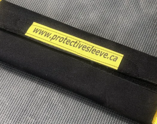 Strap saver on a yellow load strap