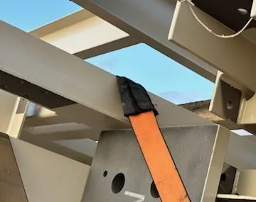 Strap saver over a steel beam