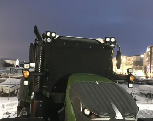Windshield cover on a tractor cab