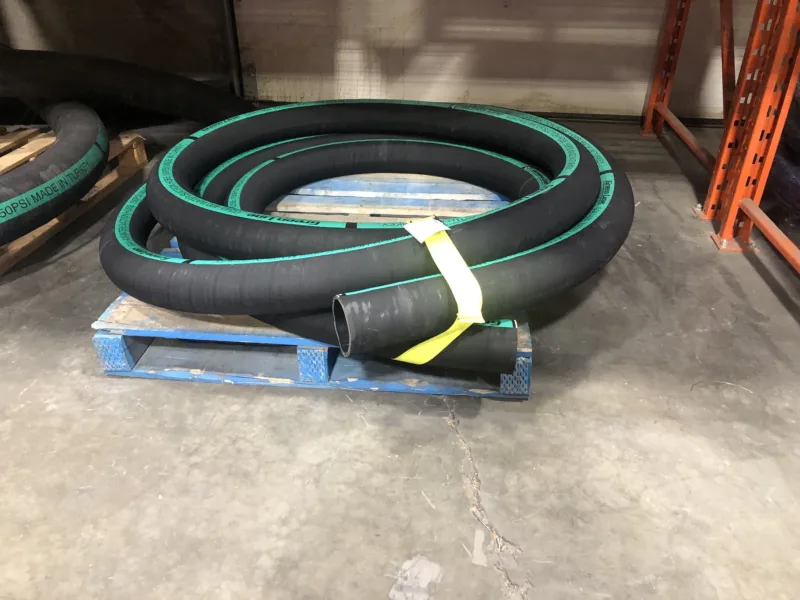 Yellow strap bundling hose on a pallet