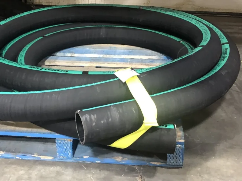 Yellow strap bundling hose on a pallet