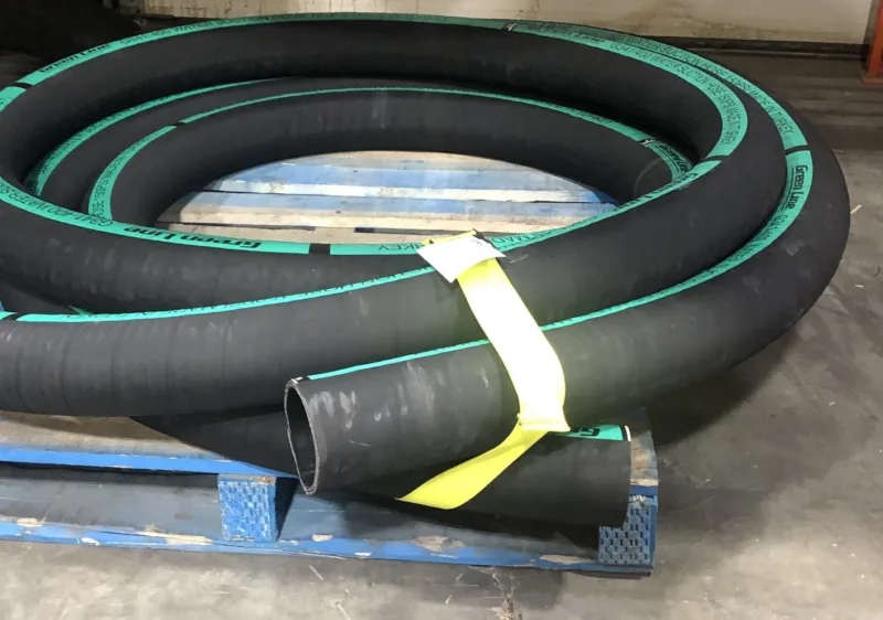 Yellow strap bundling hose on a pallet