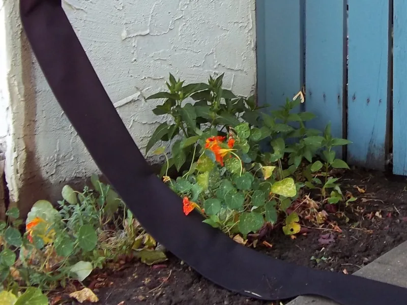 Flexible Downspout across a garden