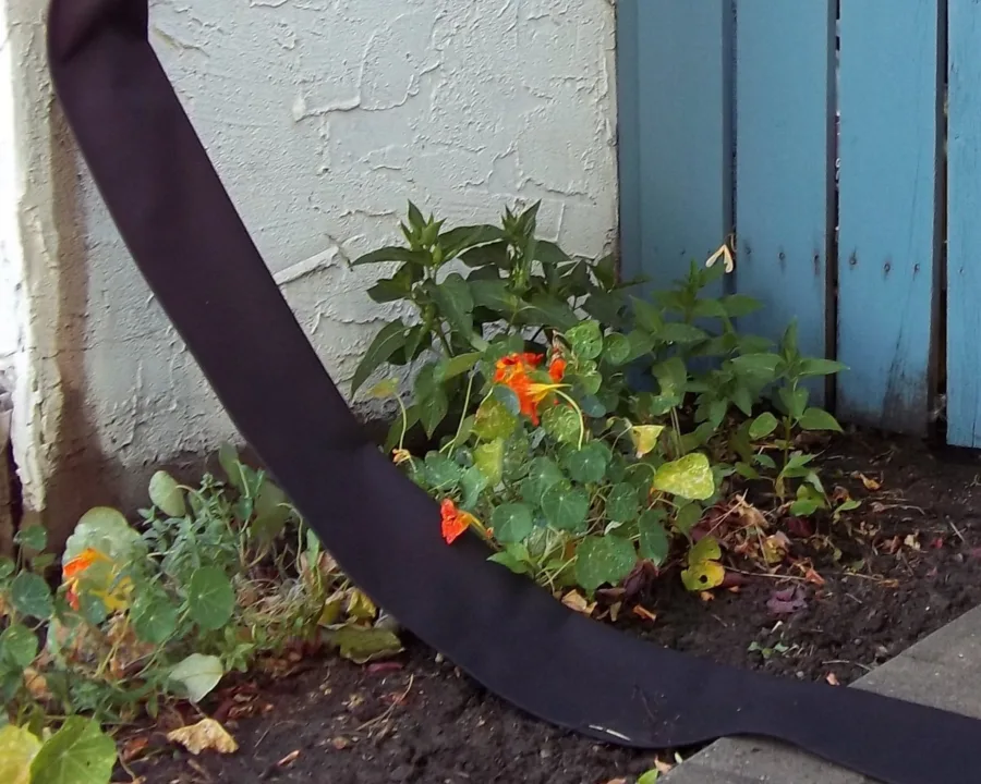 Flexible Downspout across a garden