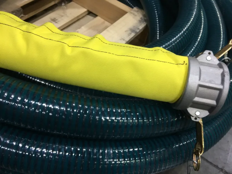 Yellow sleeve over a suction hose