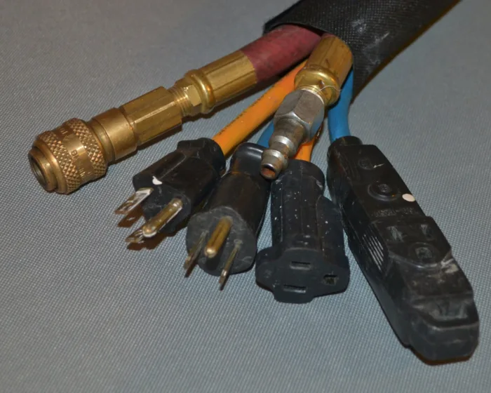 Sleeve bundling air lines and cords