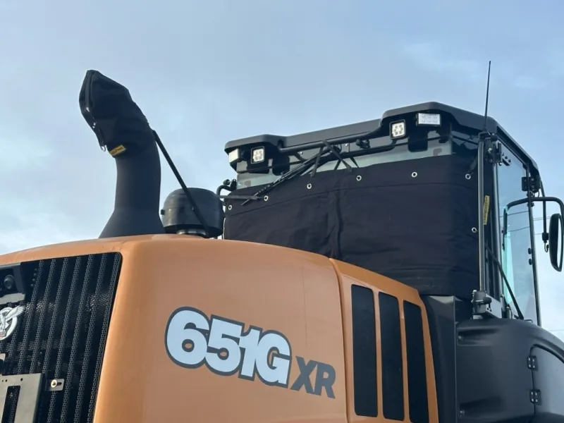 Windshield cover on a loader cab